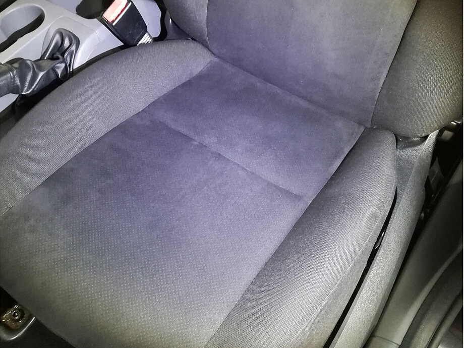 The same seat after a shampoo and hot-water extraction
